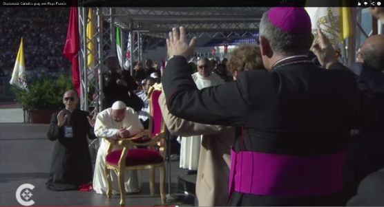 Pope Francis Kneels as Charismatic Catholics Pray Over Him, via Catholic News Service, 6/2/14